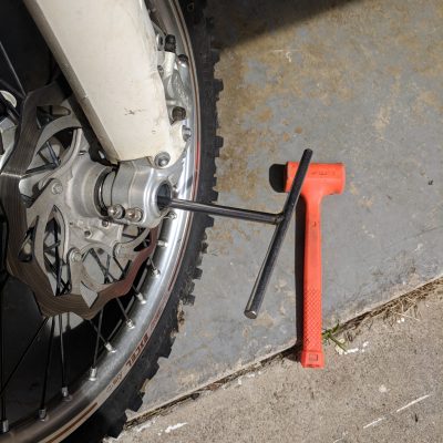 Front axle removal with t-wrench