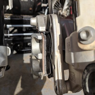 Brake pads separated for wheel mounting