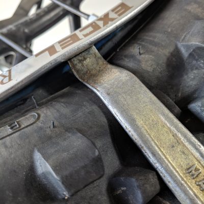 Drop tire bead from rim