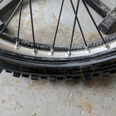 Pushing wheel into the bottom of tire