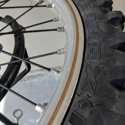 Tire bead dropped into center of wheel