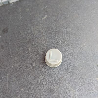 Low pressure valve cap